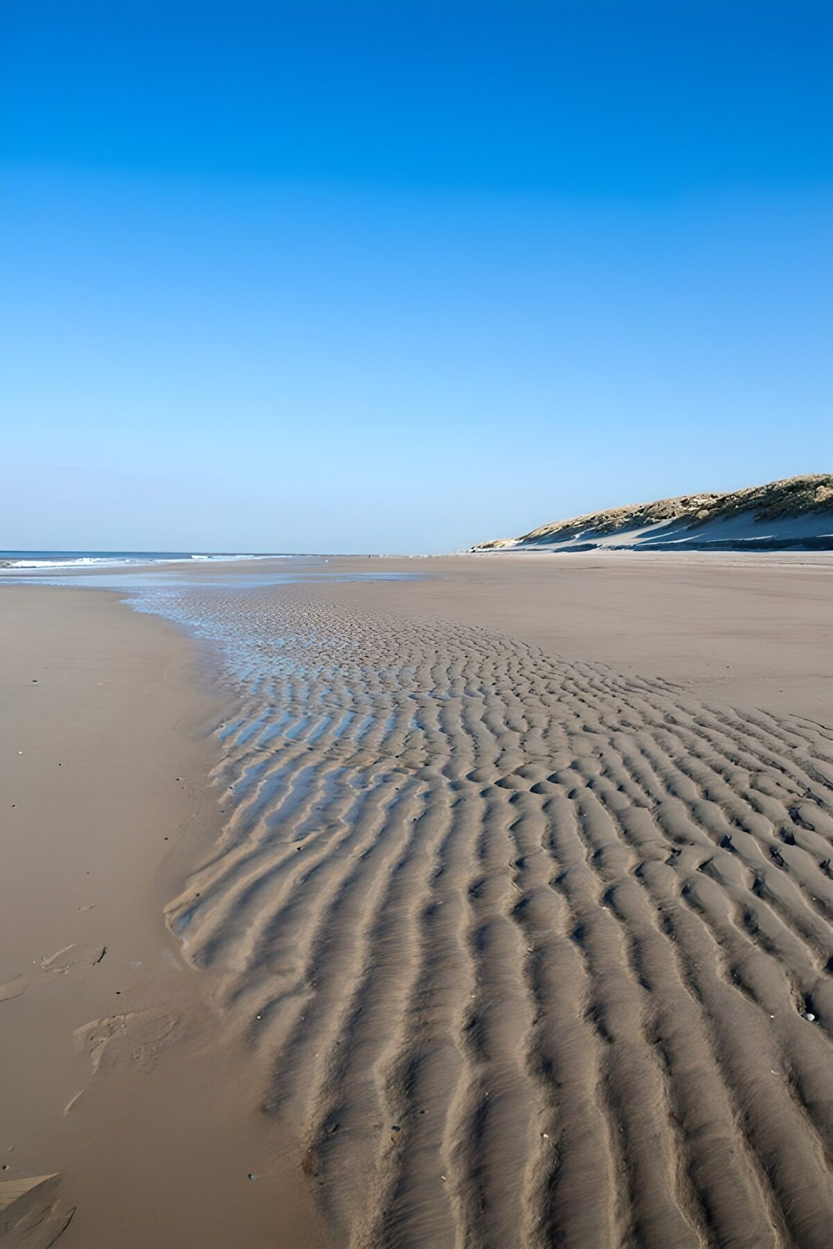 TPDE25733: Wellenmotiv am Strand