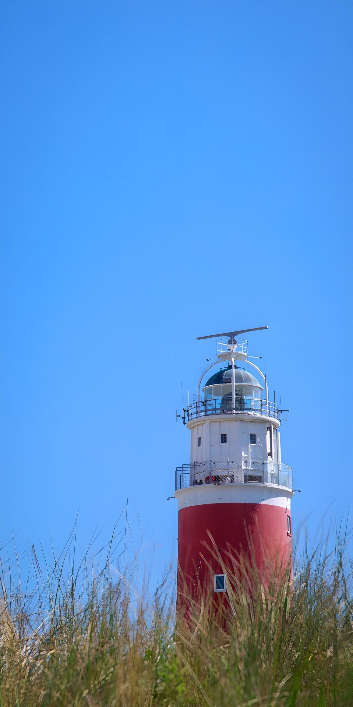 TPDE26805: Leuchtturm an einem blauen Himmel
